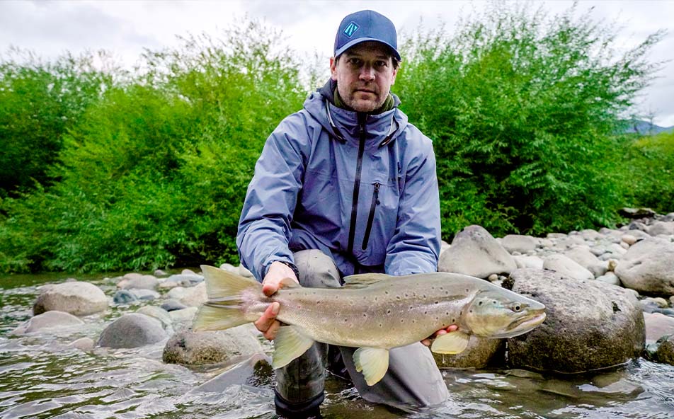 Angler trout fishing near Eleven Experience's Rio Palena Lodge on an Eleven Angling adventure